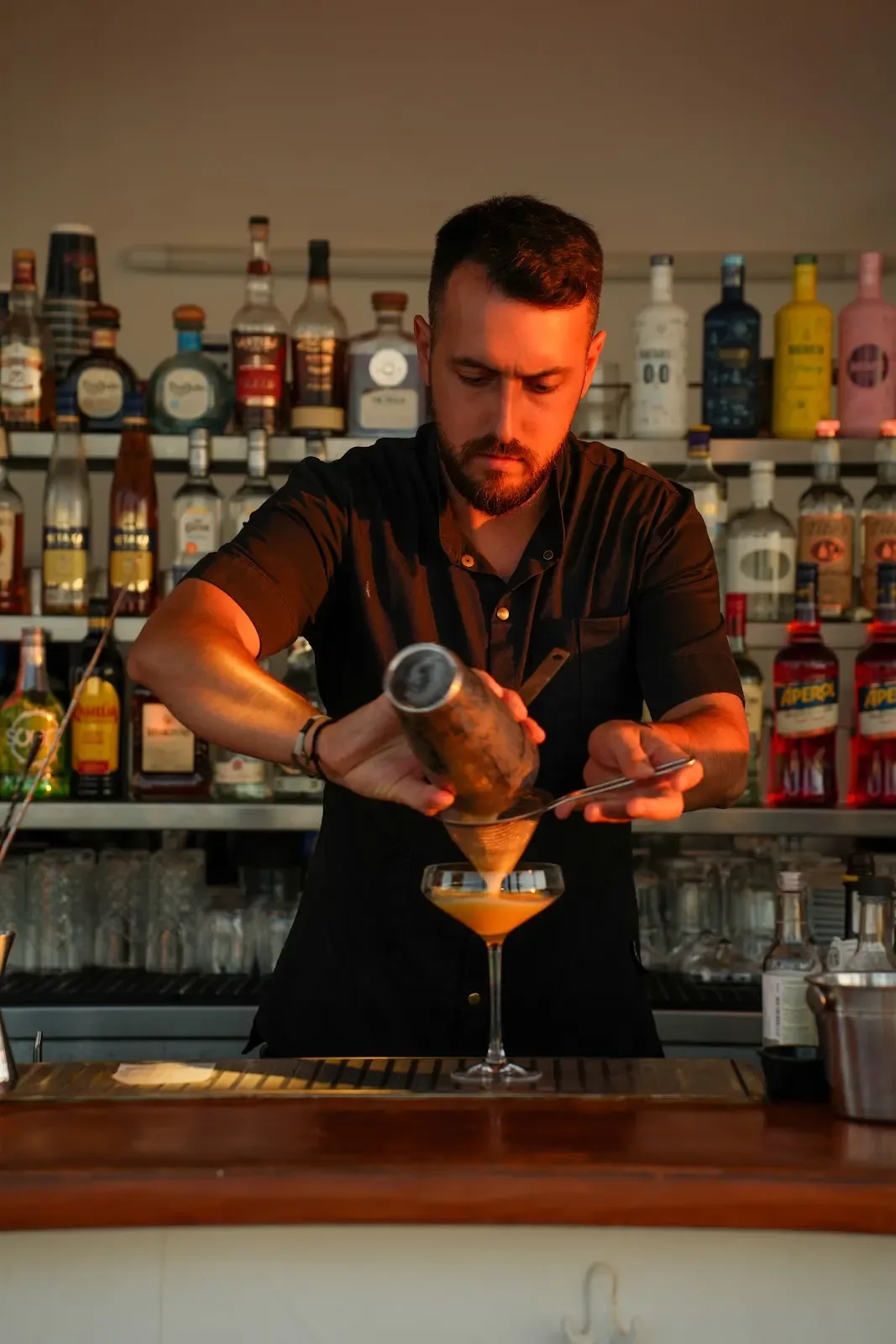 A bartender preparing a cocktail