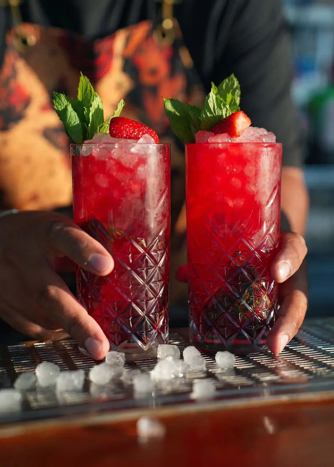 Two berry cocktails served over ice