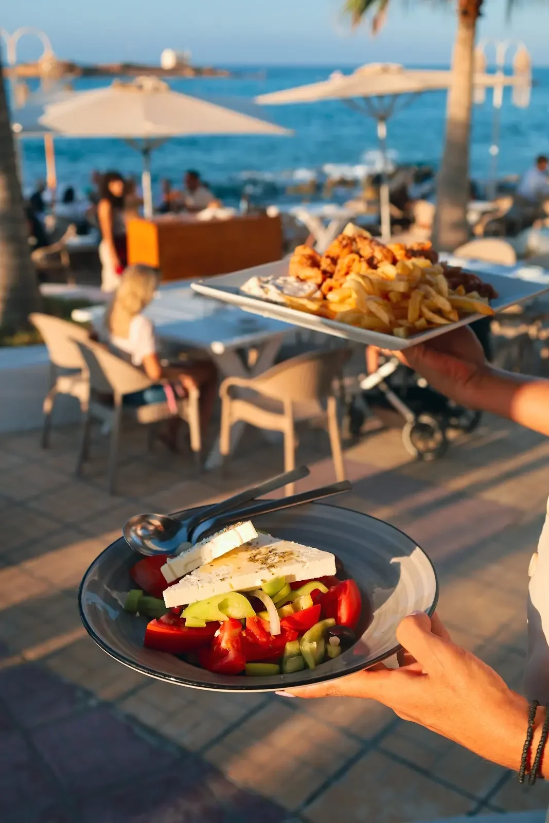 Mediterranean dishes served at a table by the sea