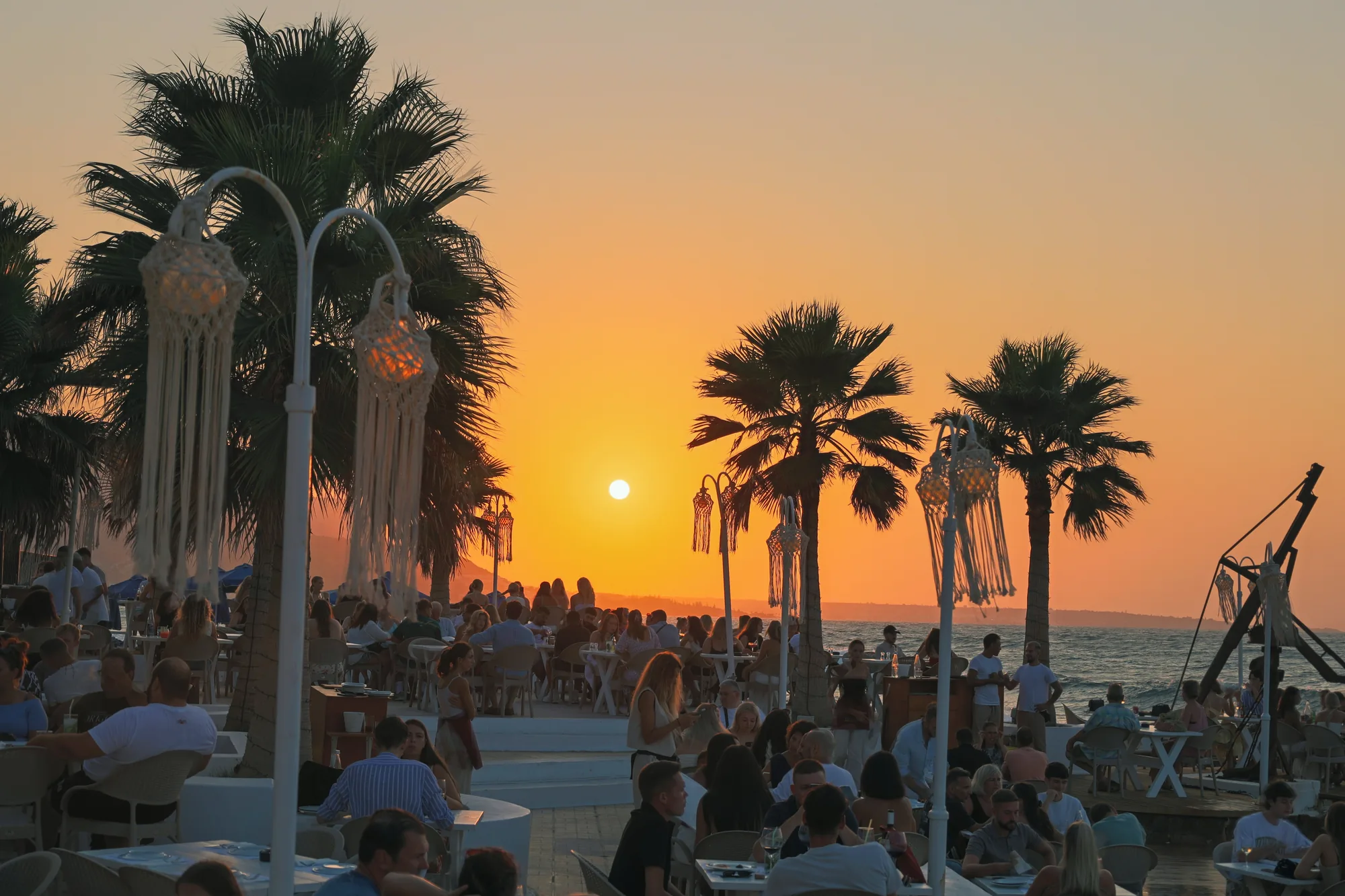 Sunset over Thalassa’s waterfront terrace