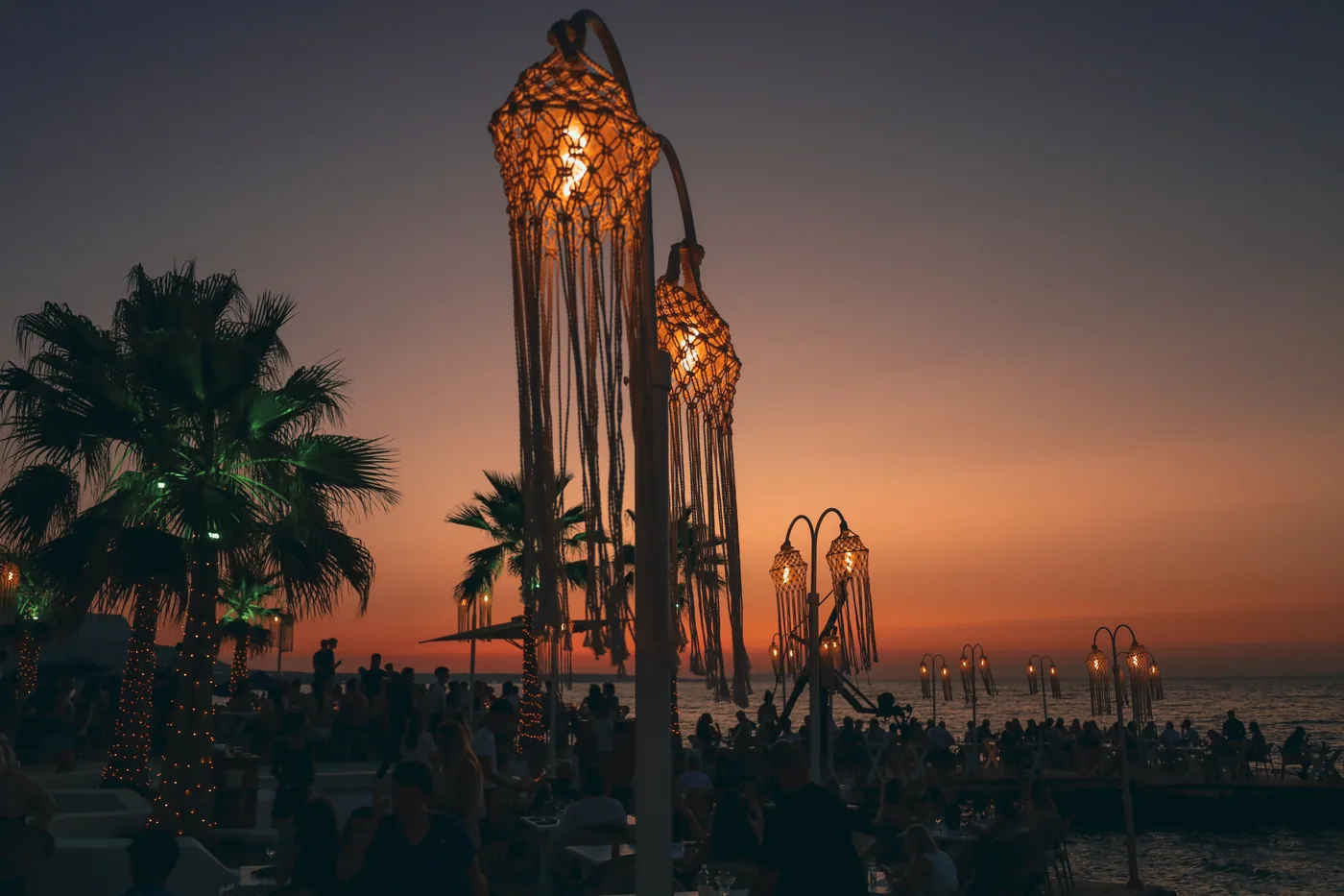 Lantern silhouettes against a Cretan sunset